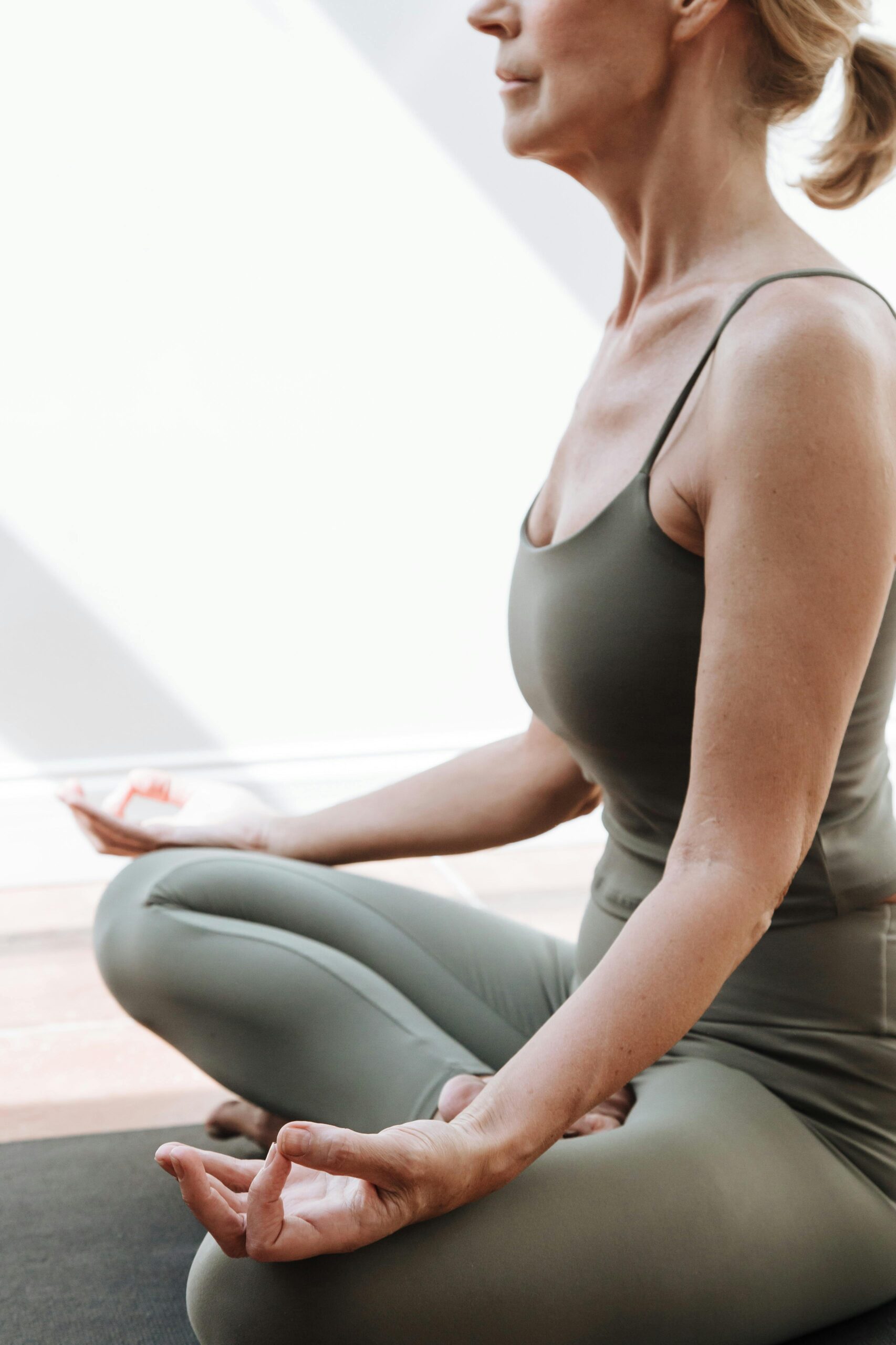 Woman doing yoga in a calm wellness setting